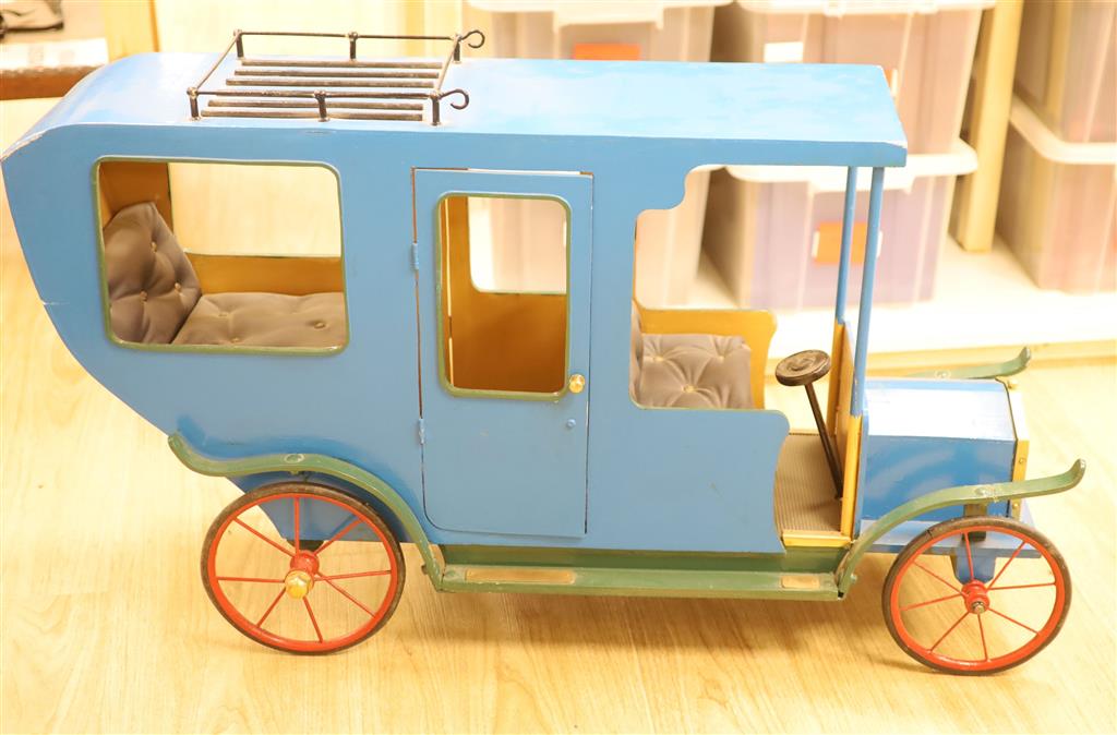 A novelty early 20th century model car, width 108cm height 62cm